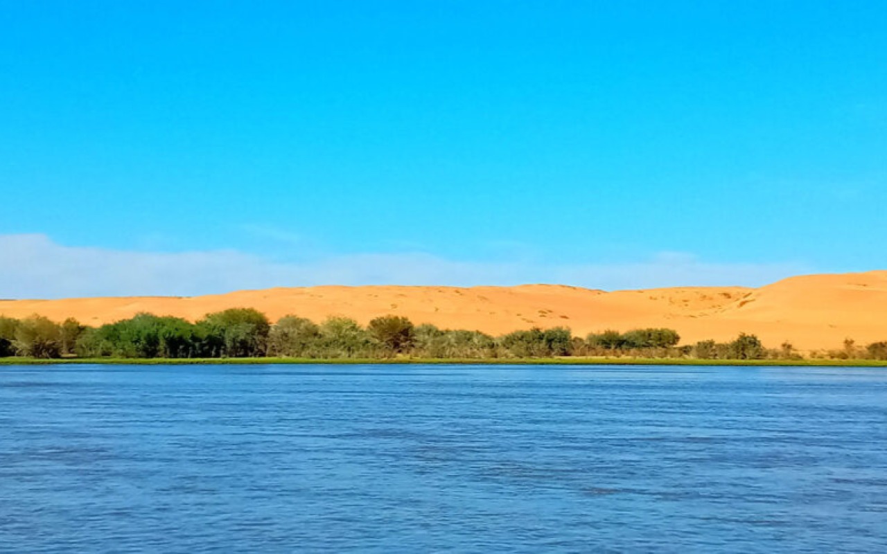  Stunning Zavkhan river bordering Ikh Mongol sand dunes – Durvuljin, Zavkhan province, Mongolia | Premium Travel Mongolia